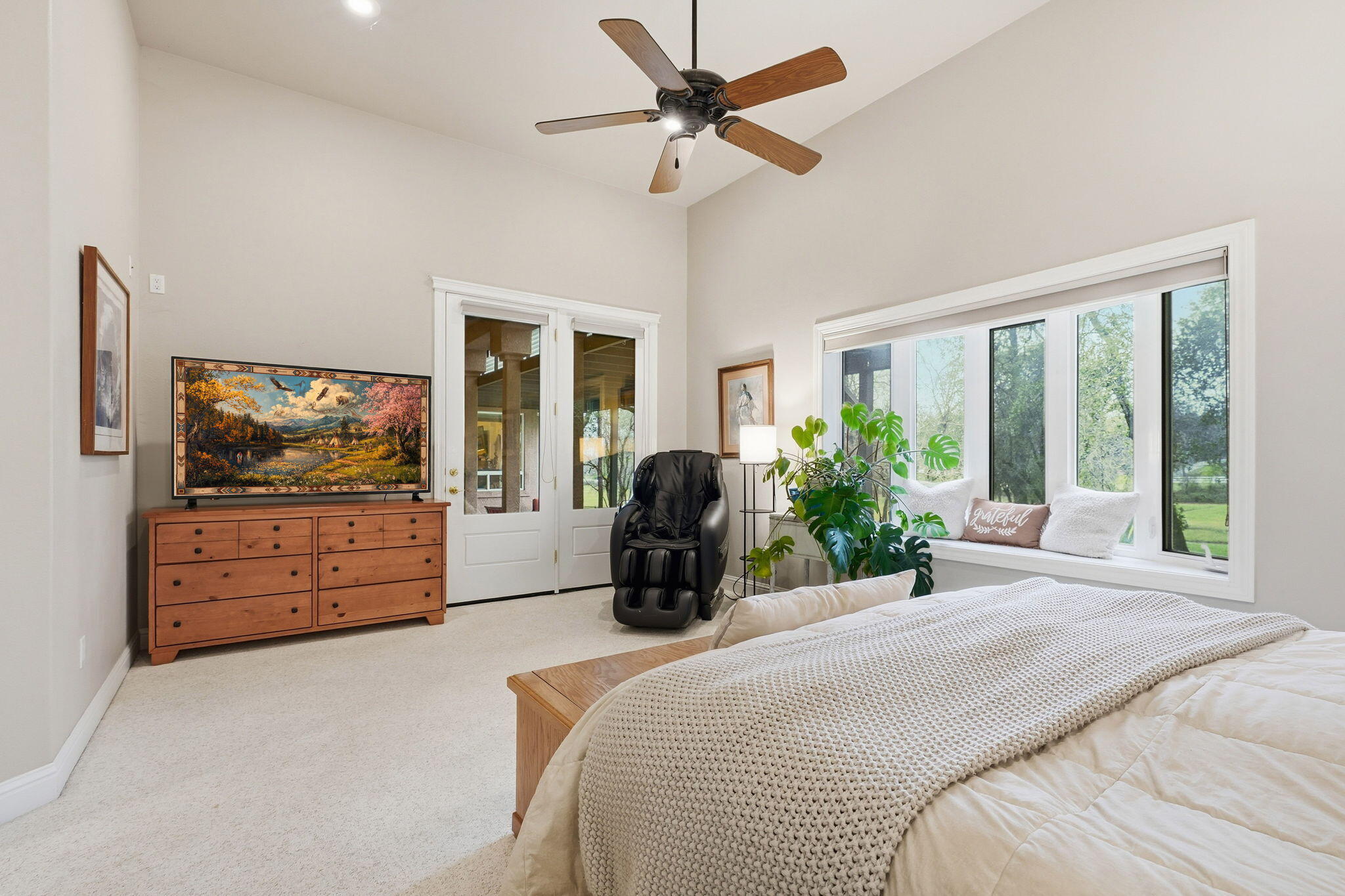 13482 Tierra Heights Road Redding, CA 96003 - Photo 17 of 41 a bedroom with a bed and a large window