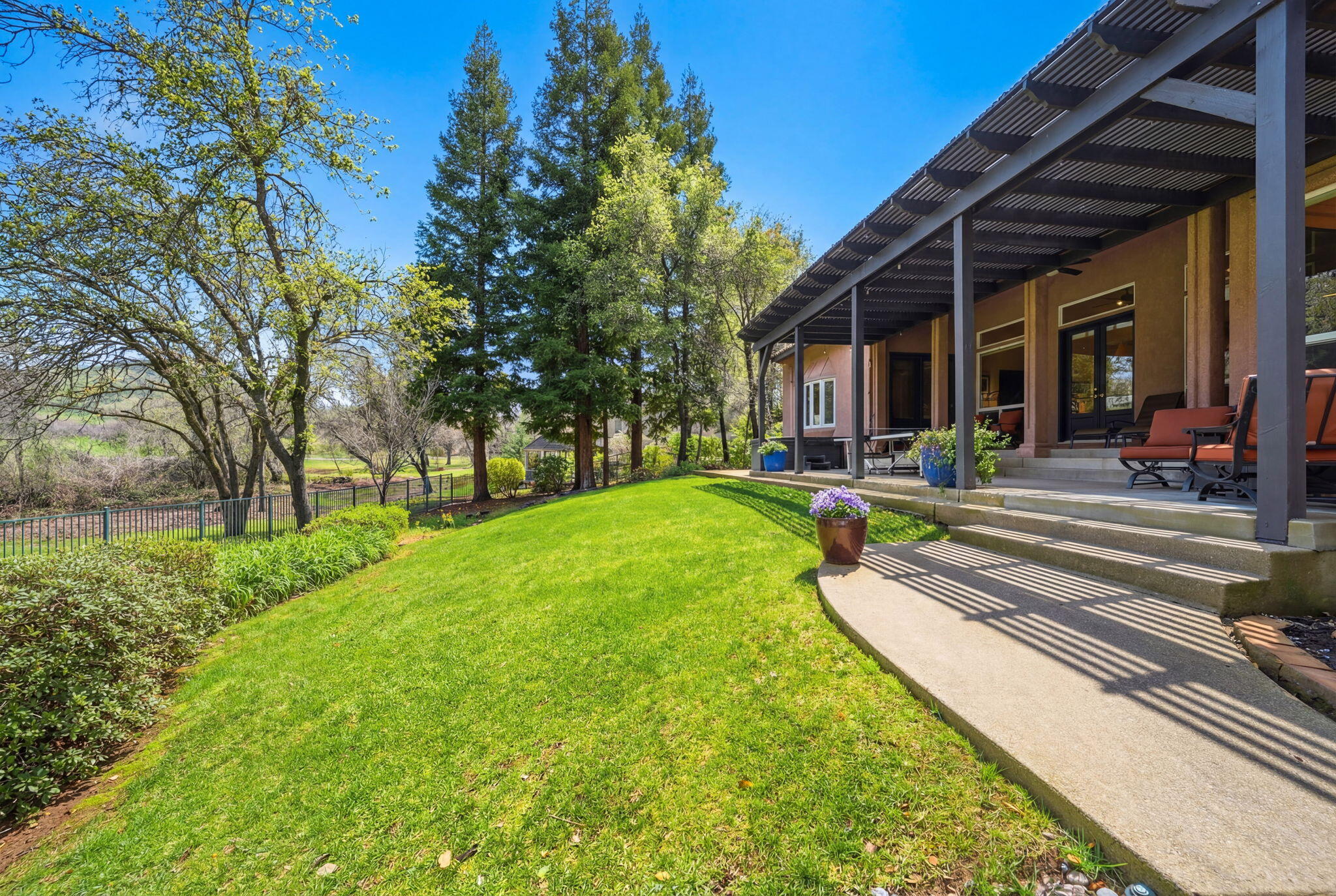 13482 Tierra Heights Road Redding, CA 96003 - Photo 35 of 41 a view of a house with a yard patio and fire pit