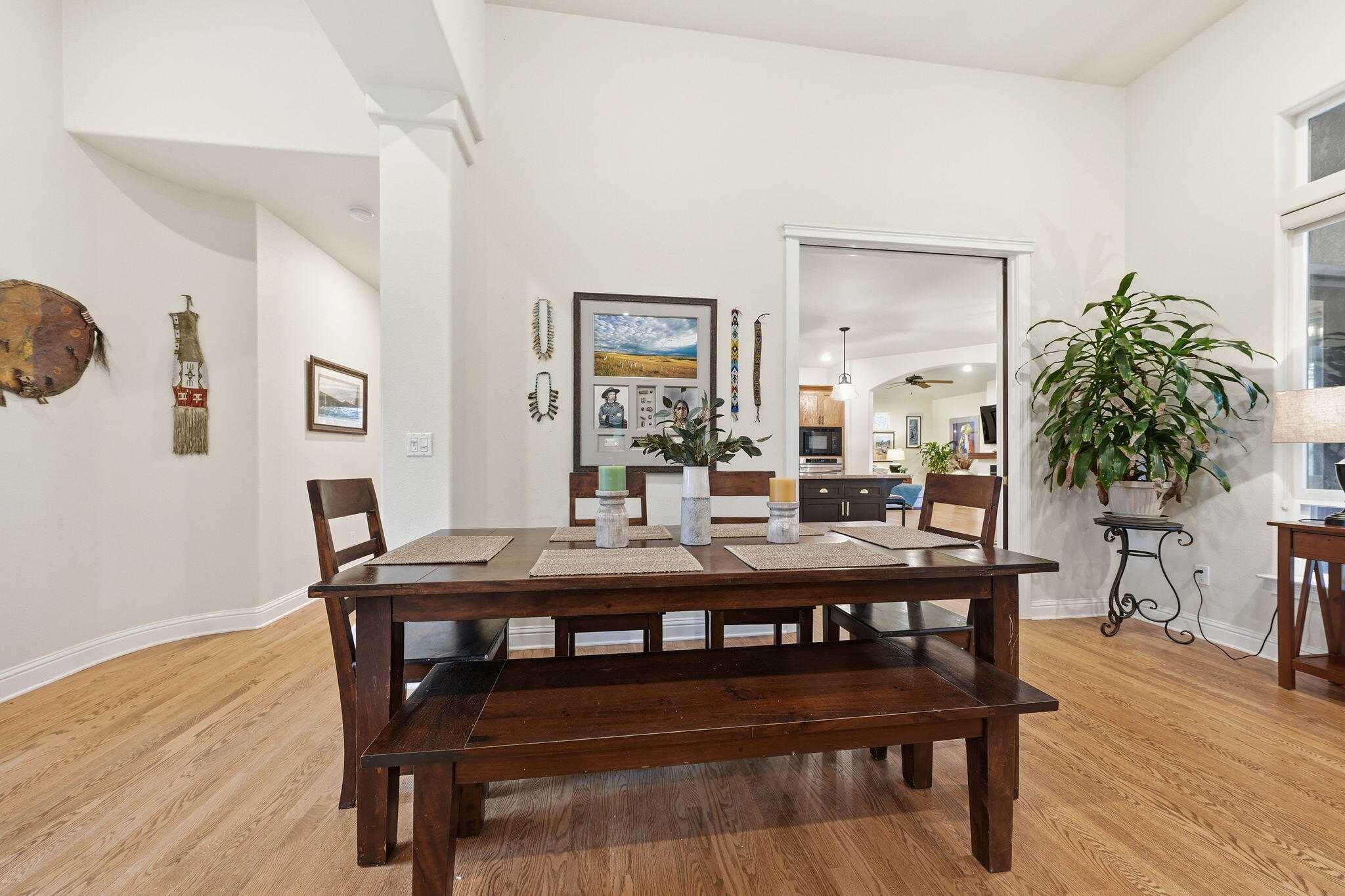 13482 Tierra Heights Road Redding, CA 96003 - Photo 8 of 41 a dining room with furniture potted plants and wooden floor