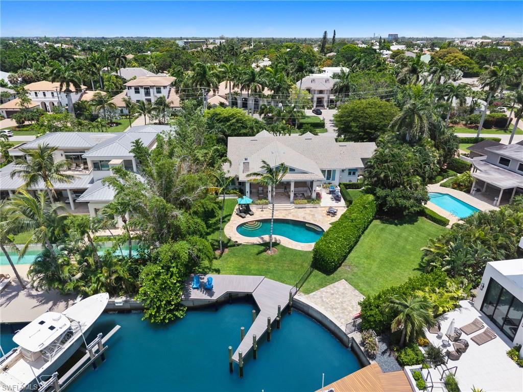 2201 Beacon Lane Naples, FL 34103 - Photo 3 of 25 an aerial view of multiple houses with yard