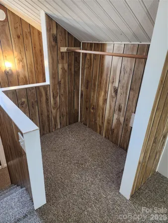 a view of balcony with wooden floor
