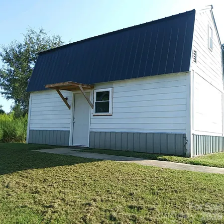 a front view of a house having yard