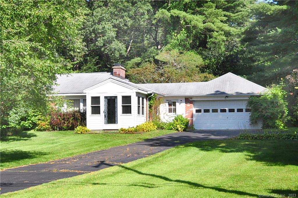 140 Wells Road Granby, CT 06035 - Photo 1 of 1 a front view of a house with garden