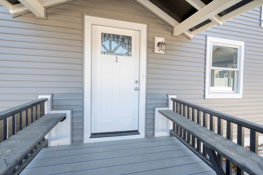 665 State Road, Unit 1 Plymouth, MA 02360 - Photo 3 of 13 a view of wooden balcony