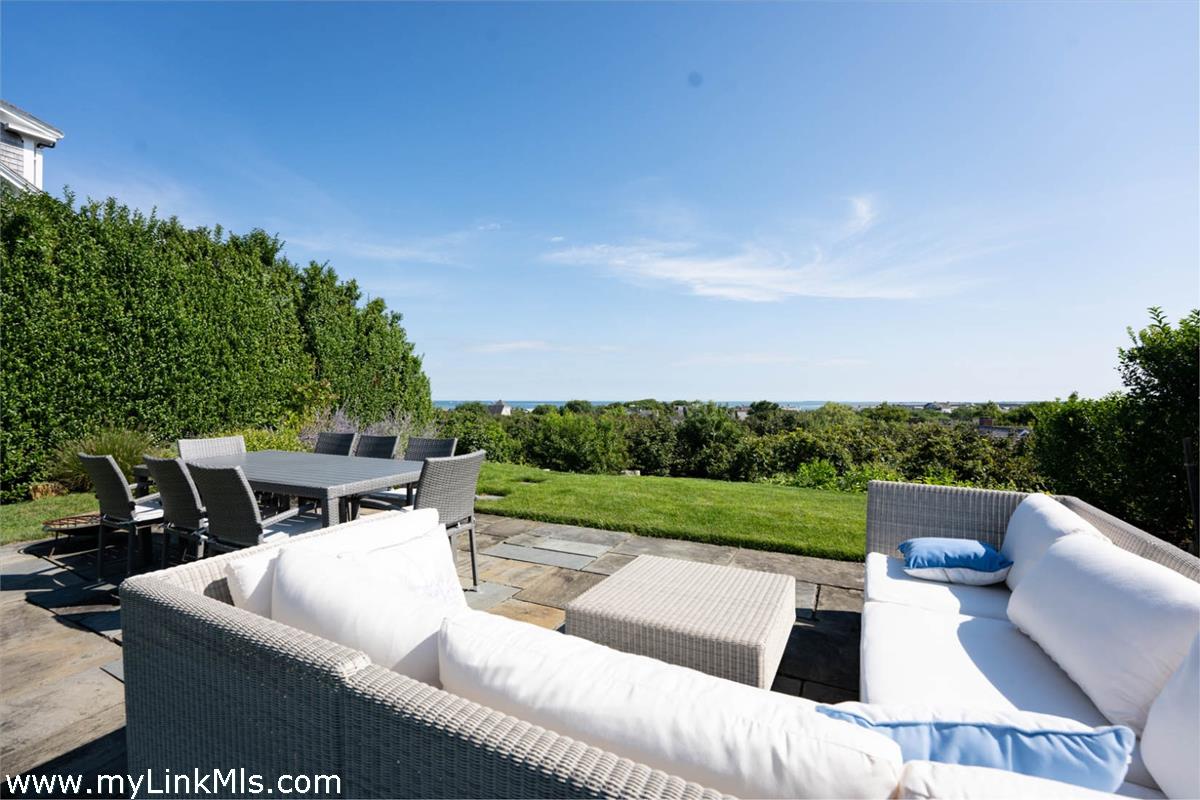 41 B Cliff Road Nantucket, MA 02554 - Photo 12 of 34 a view of outdoor sitting area with furniture and garden