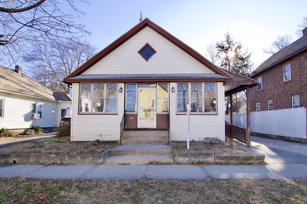 57 Bevier Street Springfield, MA 01107 - Photo 1 of 22 a front view of a house with garden
