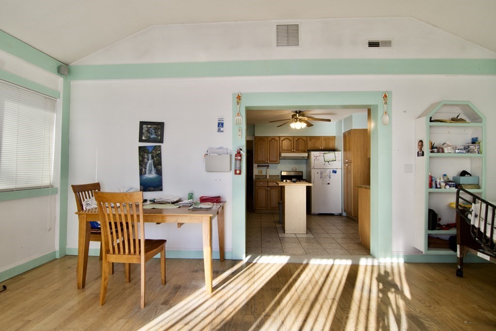 57 Bevier Street Springfield, MA 01107 - Photo 13 of 22 a view of a dining room with furniture and wooden floor