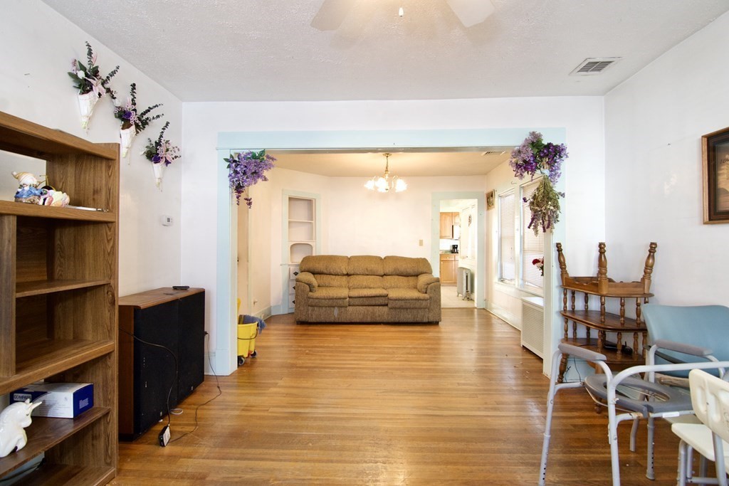 57 Bevier Street Springfield, MA 01107 - Photo 15 of 22 a living room with furniture and a flat screen tv