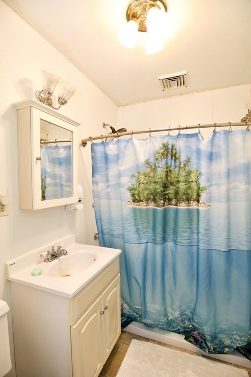 57 Bevier Street Springfield, MA 01107 - Photo 17 of 22 a bathroom with a sink and a mirror