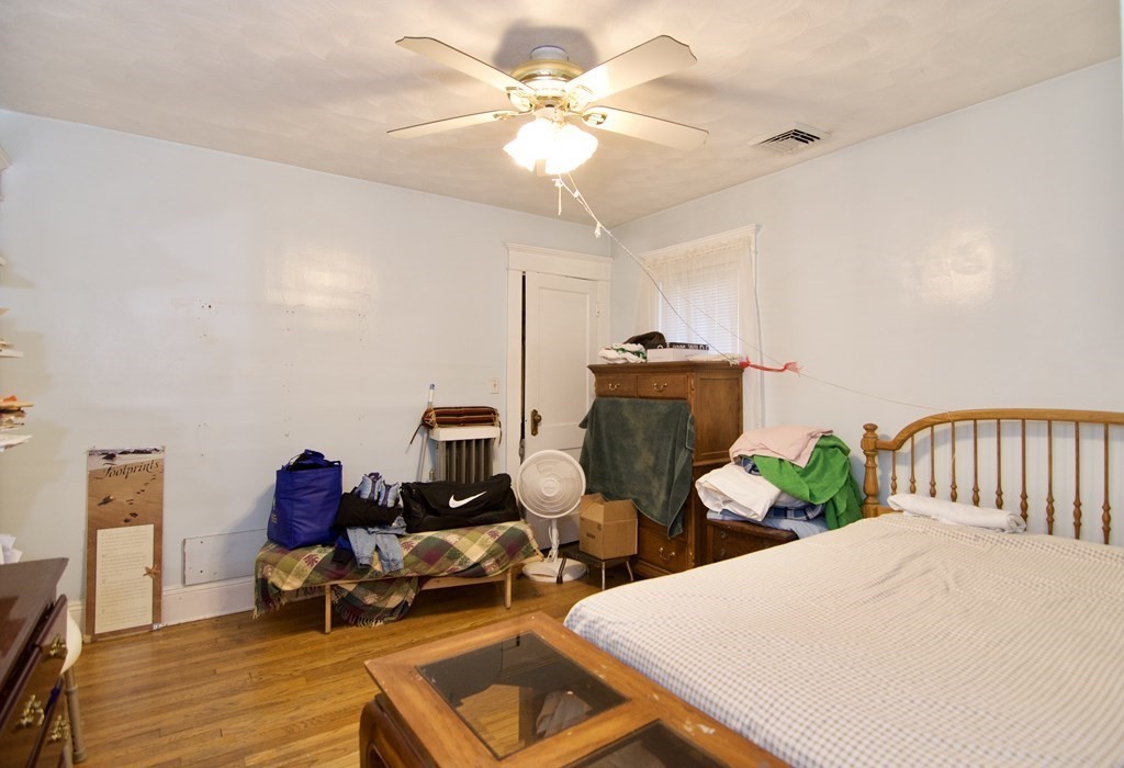 57 Bevier Street Springfield, MA 01107 - Photo 20 of 22 a living room with furniture a chandelier and a table