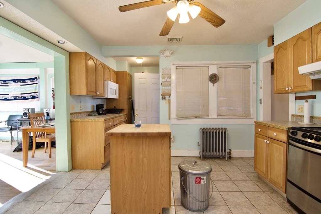 57 Bevier Street Springfield, MA 01107 - Photo 6 of 22 a kitchen with refrigerator and cabinets