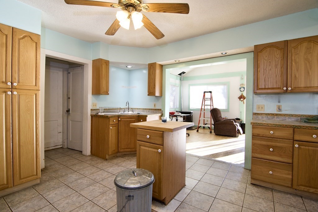 57 Bevier Street Springfield, MA 01107 - Photo 7 of 22 a kitchen with a sink and a stove top oven