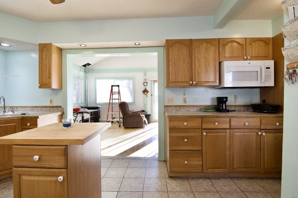 57 Bevier Street Springfield, MA 01107 - Photo 8 of 22 a kitchen with a sink cabinets and window