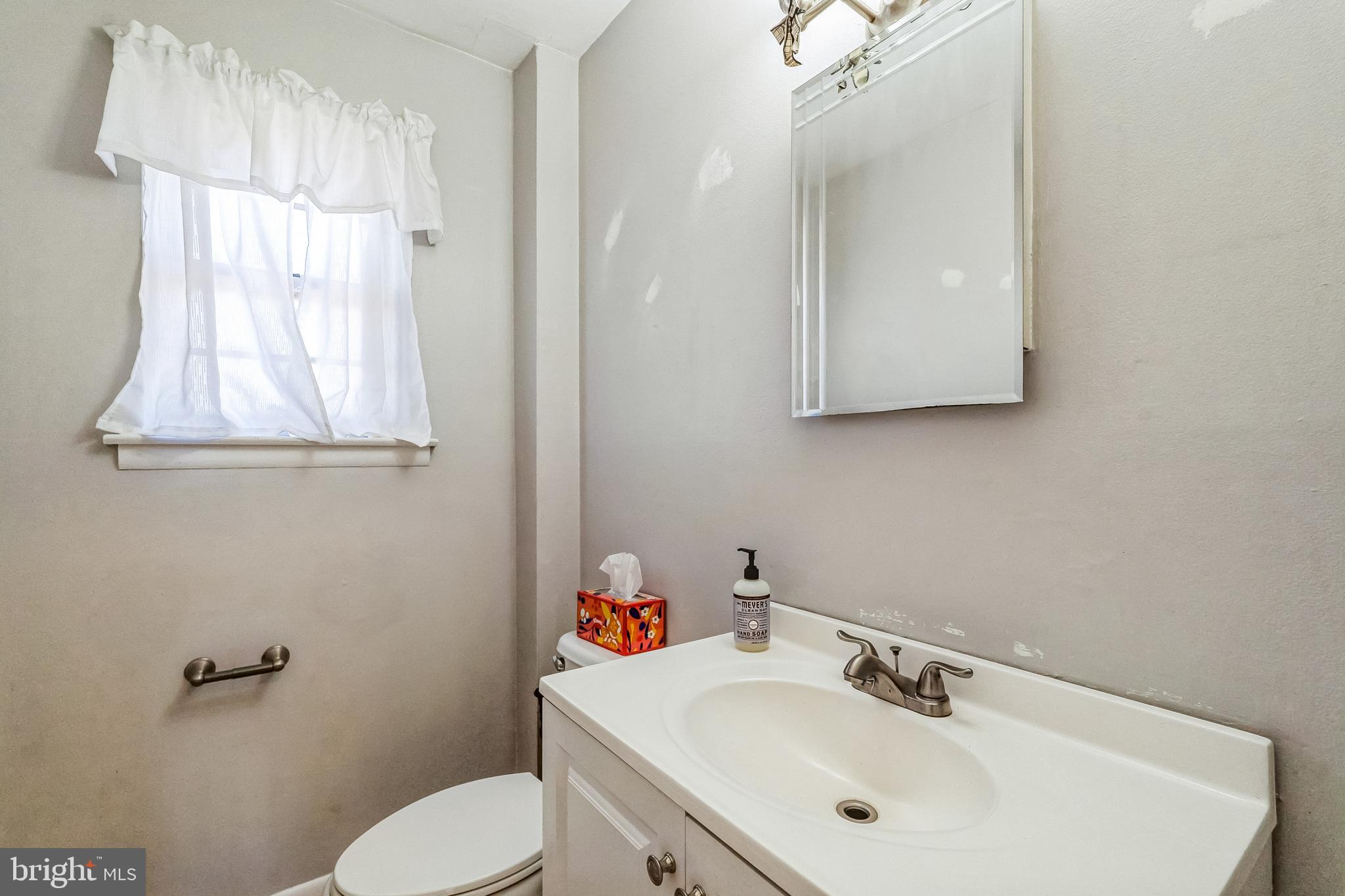 315 Shaw Road Ridley Park, PA 19078 - Photo 16 of 50 a bathroom with a sink mirror and toilet