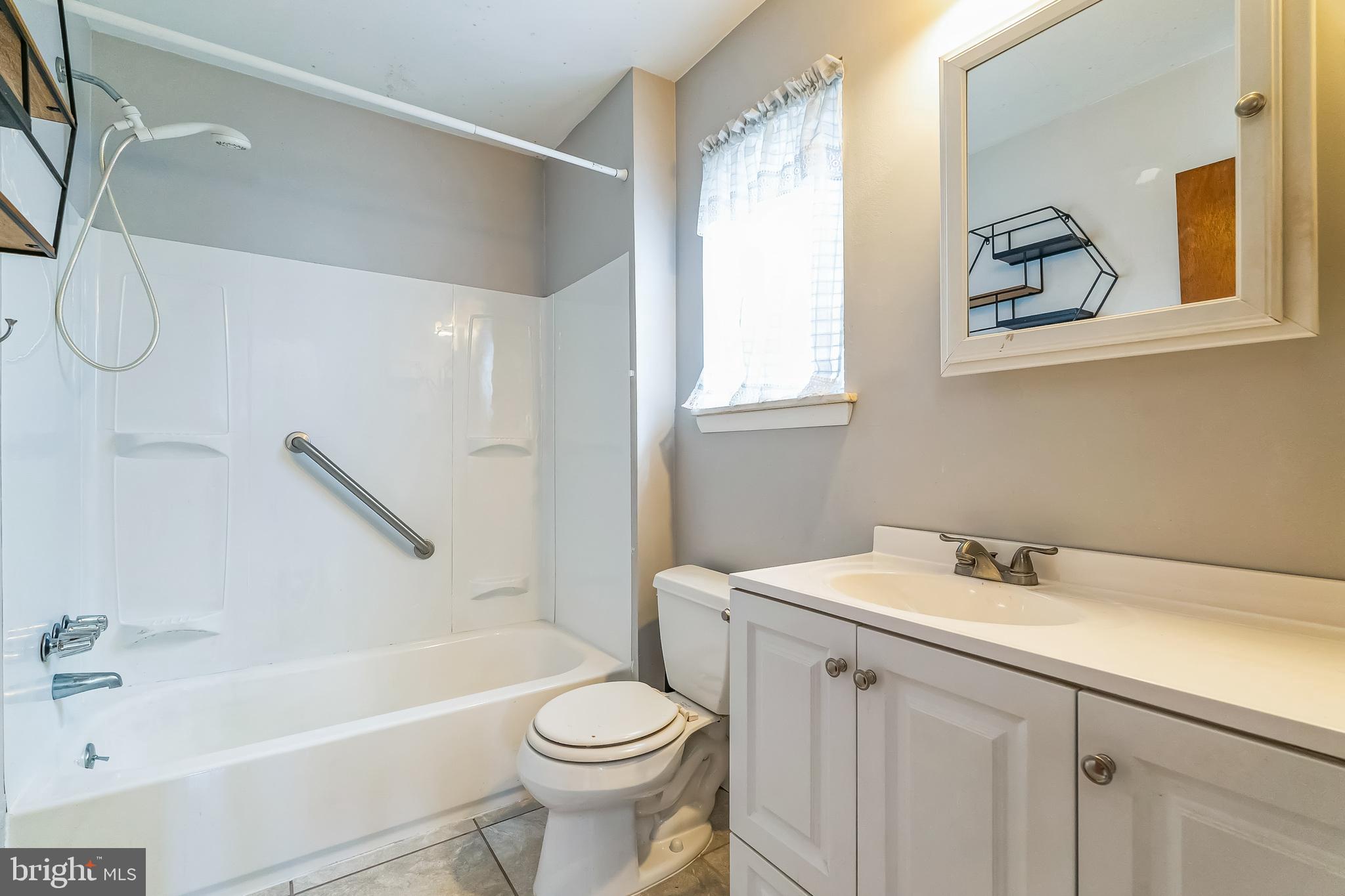 315 Shaw Road Ridley Park, PA 19078 - Photo 23 of 50 a bathroom with a sink a toilet and a bathtub
