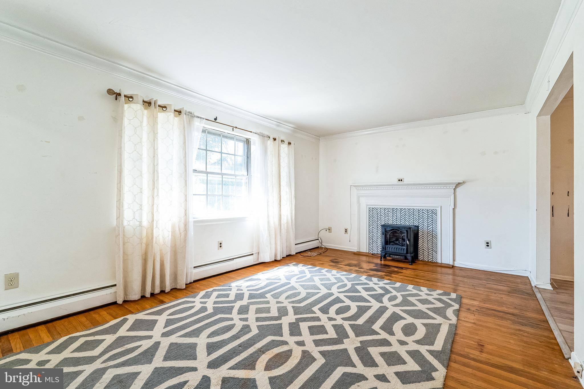 315 Shaw Road Ridley Park, PA 19078 - Photo 3 of 50 a view of empty room with window and fireplace