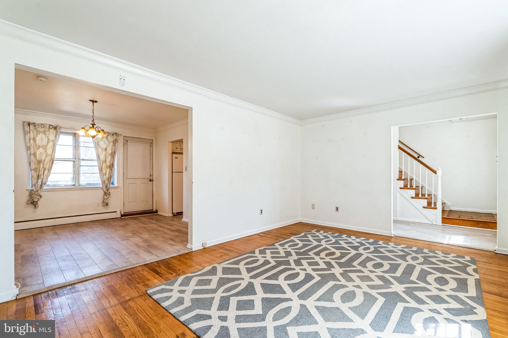 315 Shaw Road Ridley Park, PA 19078 - Photo 8 of 50 an empty room with wooden floor and windows