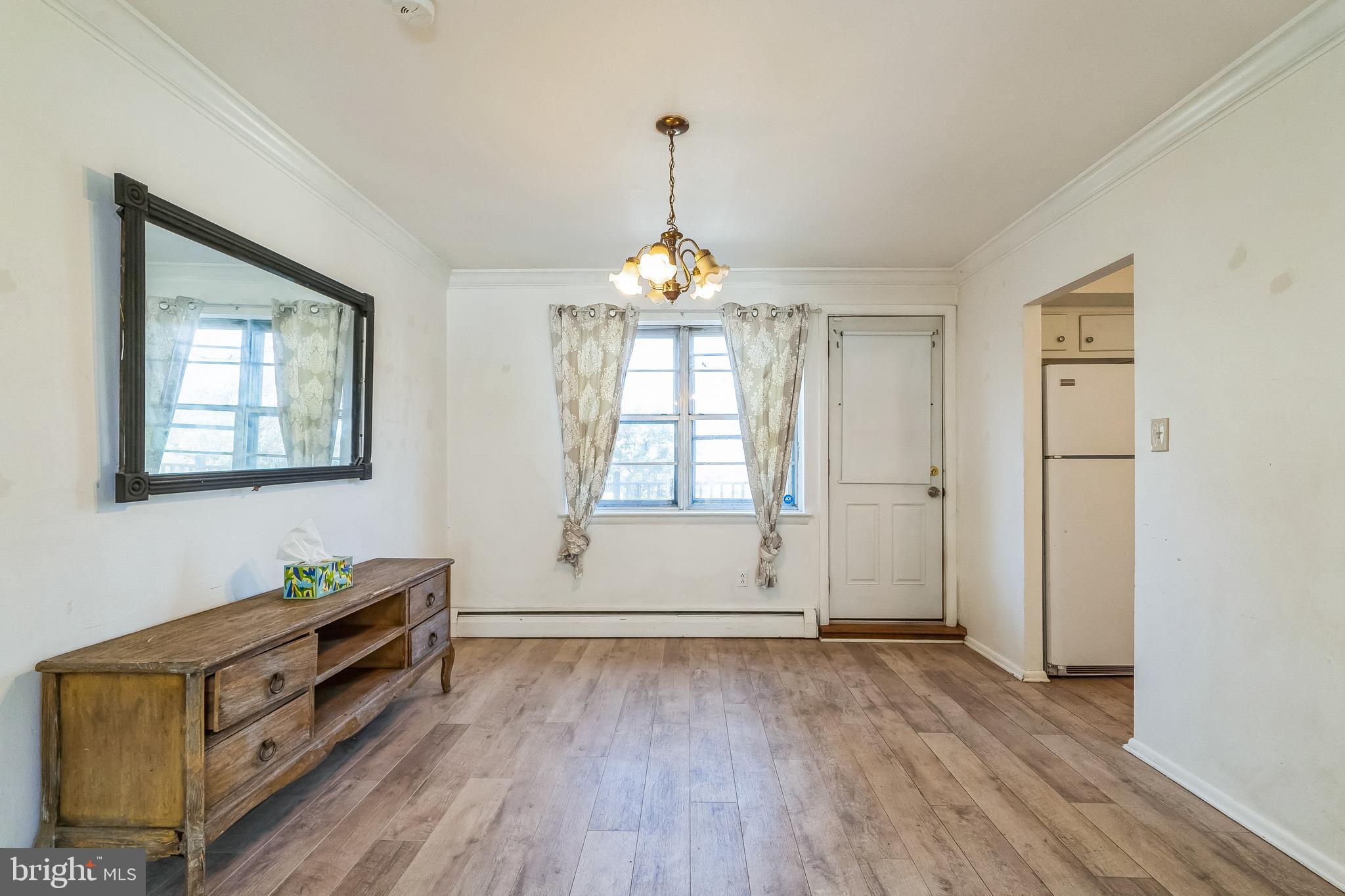 315 Shaw Road Ridley Park, PA 19078 - Photo 9 of 50 wooden floor in an empty room with a window