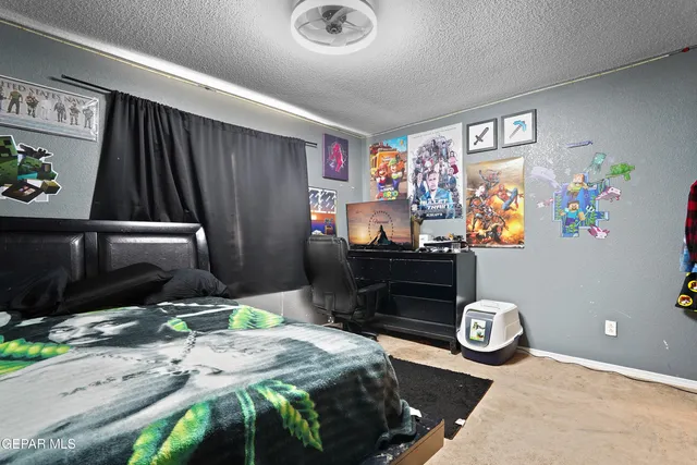 a bedroom with a bed and dresser