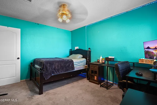 a view of a swimming pool with a lounge chair