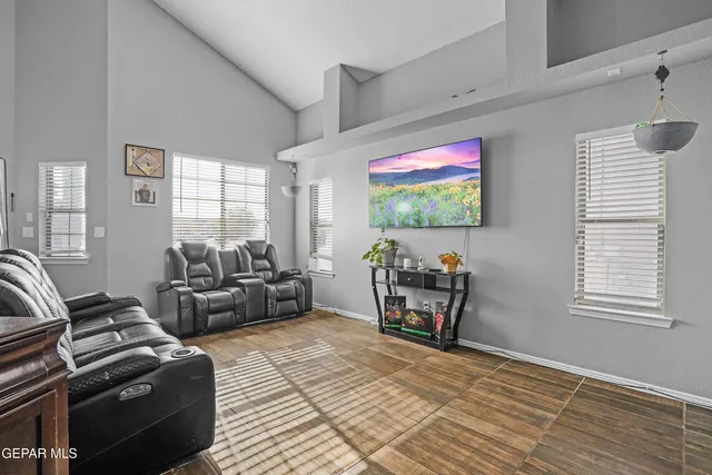 a view of a livingroom with furniture and windows