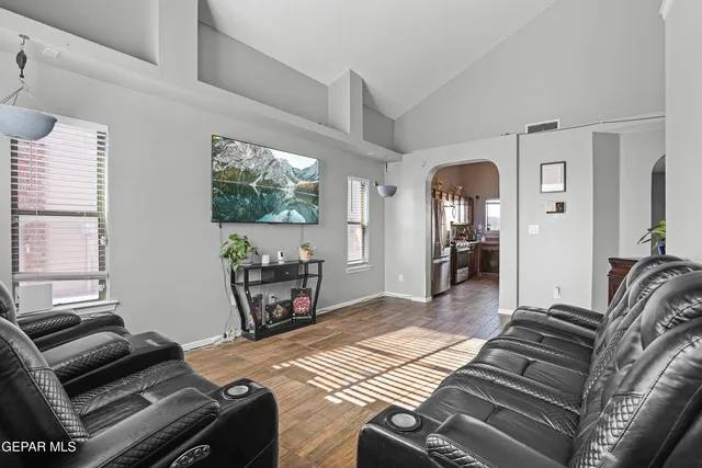 a bed room with a bed and a television