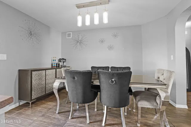 a view of a dining room with furniture and wooden floor