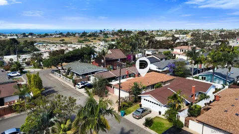 an aerial view of residential houses with outdoor space