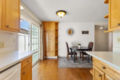 a kitchen with a sink a stove and a microwave
