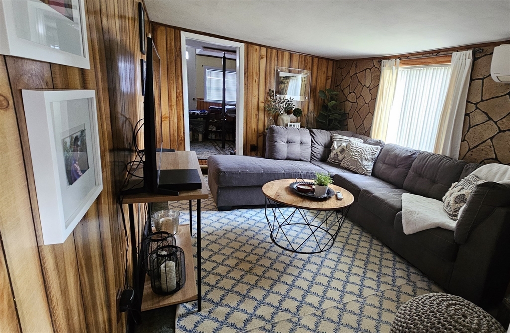 71 Russell Street Hadley, MA 01035 - Photo 16 of 32 a living room with furniture a window and a table