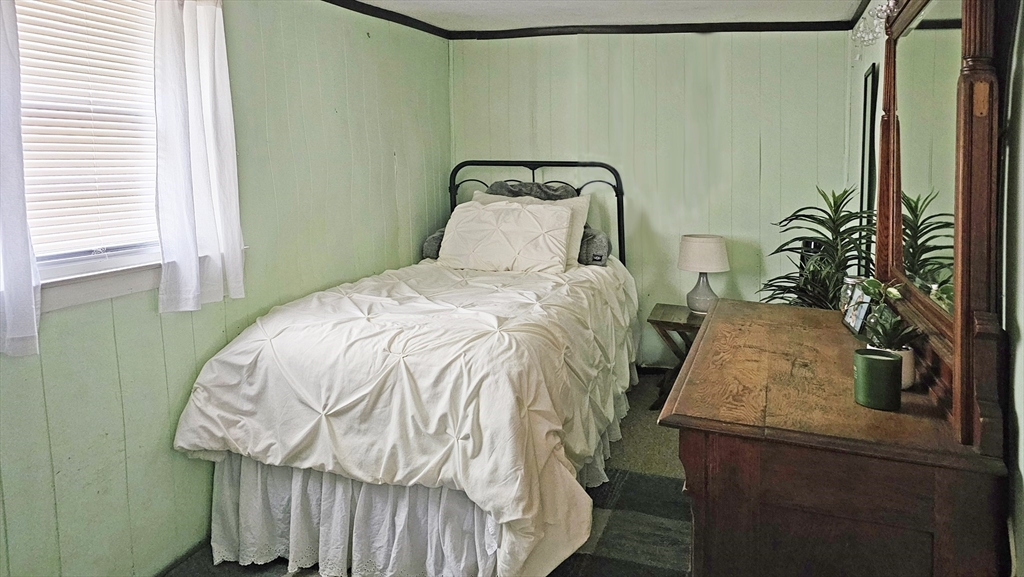 71 Russell Street Hadley, MA 01035 - Photo 21 of 32 a bed sitting in a bedroom next to a window