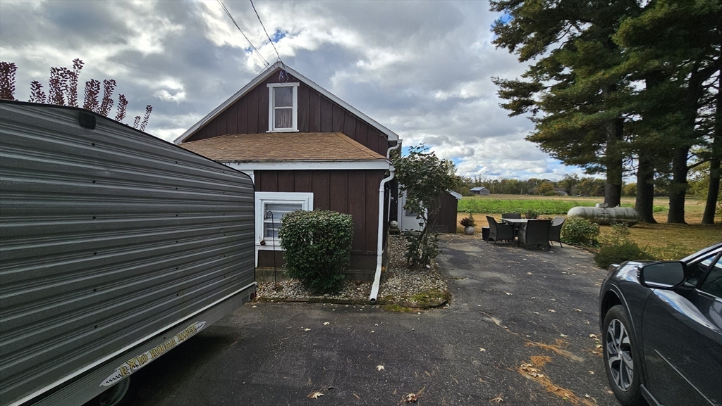 71 Russell Street Hadley, MA 01035 - Photo 7 of 32 a front view of a house with a yard