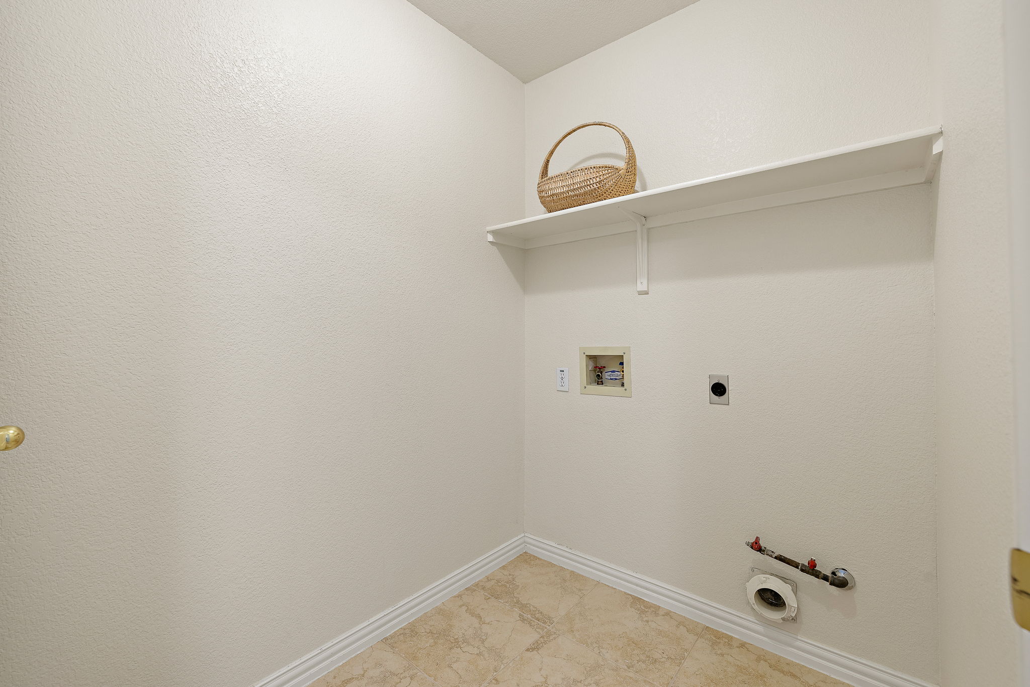 1102 Nelson Ranch Road Cedar Park, TX 78613 - Photo 31 of 37 Ready for appliances, this utility space offers convenient connections and a practical storage shelf.