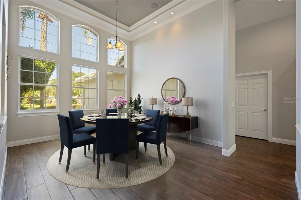 2002 Water Key Drive Windermere, FL 34786 - Photo 6 of 60 a view of a dining room with furniture window and wooden floor