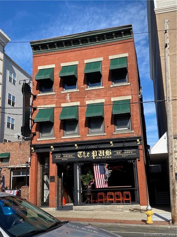 a view of a building with a street