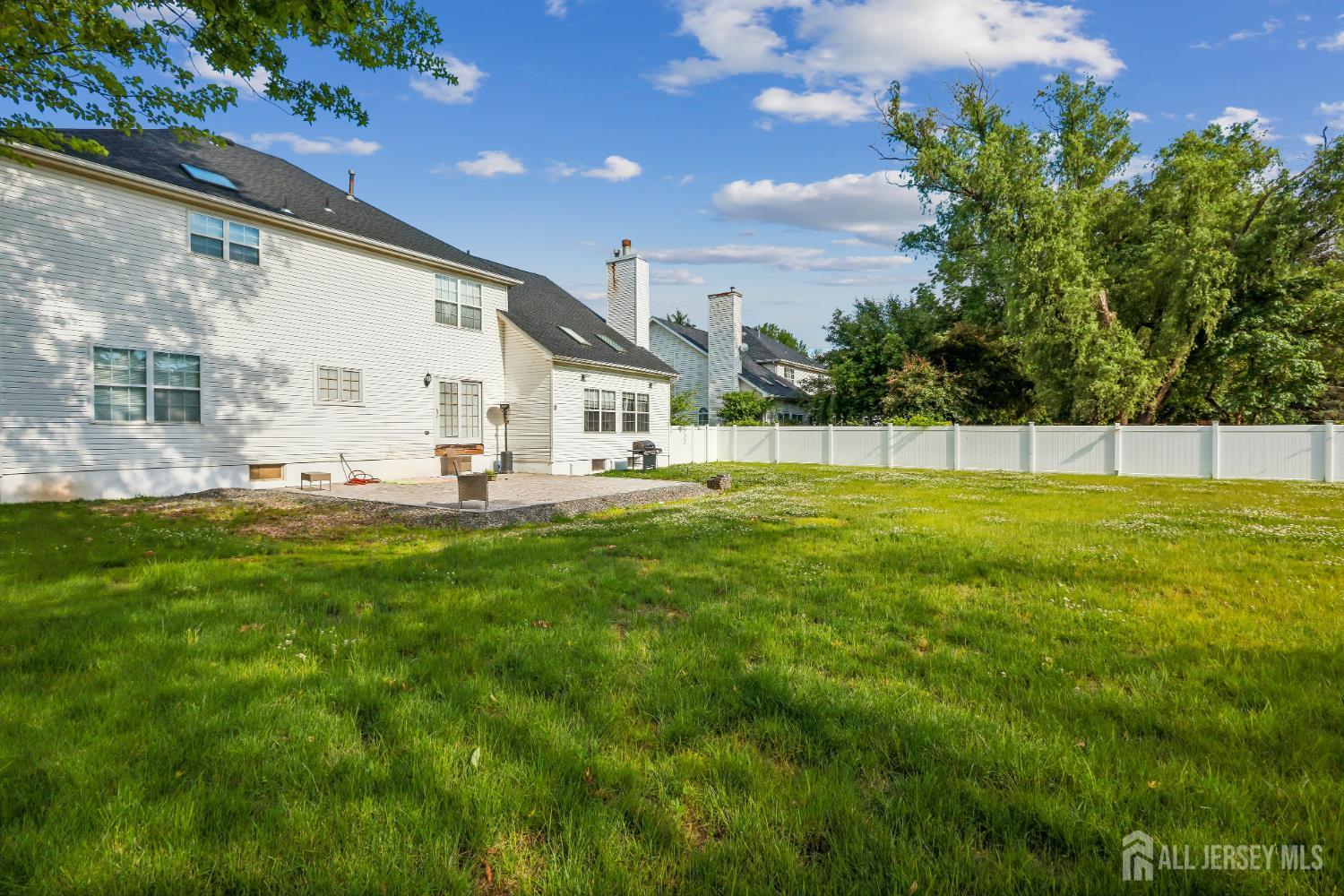 489 Plainfield Road Edison, NJ 08820 - Photo 35 of 39 a view of an house with backyard and a tree