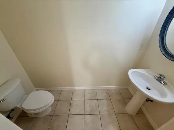a bathroom with a toilet and a sink