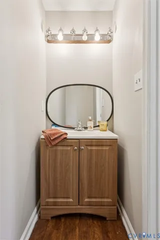 a bathroom with a sink and vanity