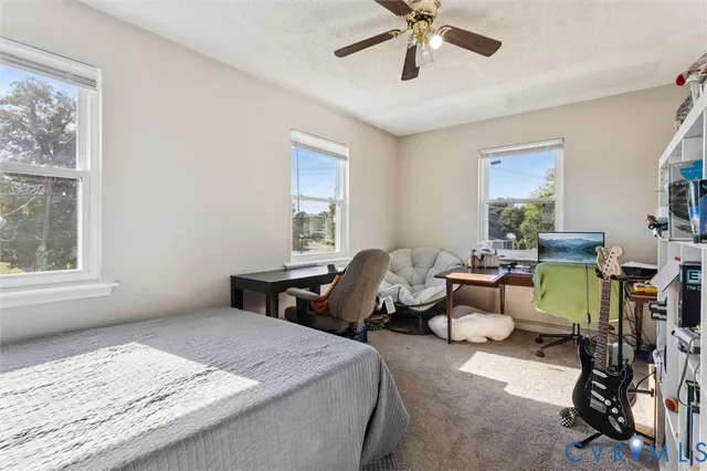 a bedroom with bed and window