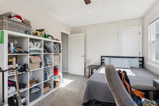 a bed room with a bed and a book shelf