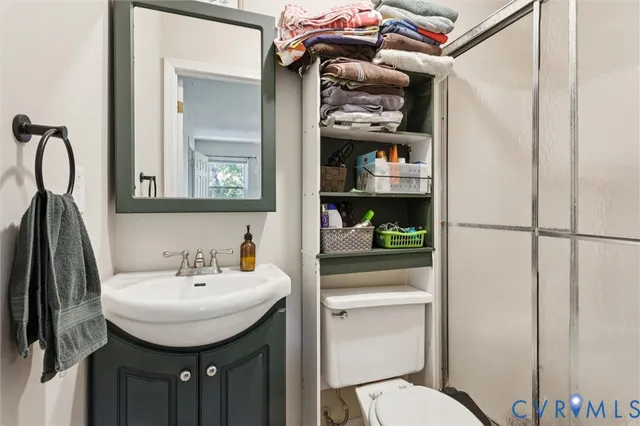 a bathroom with a sink and mirror