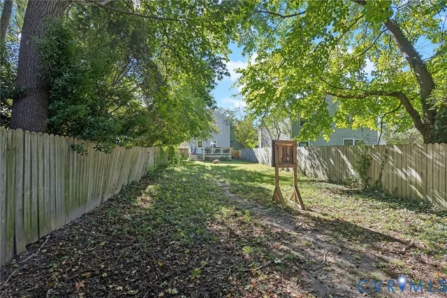 a view of a backyard with a tree