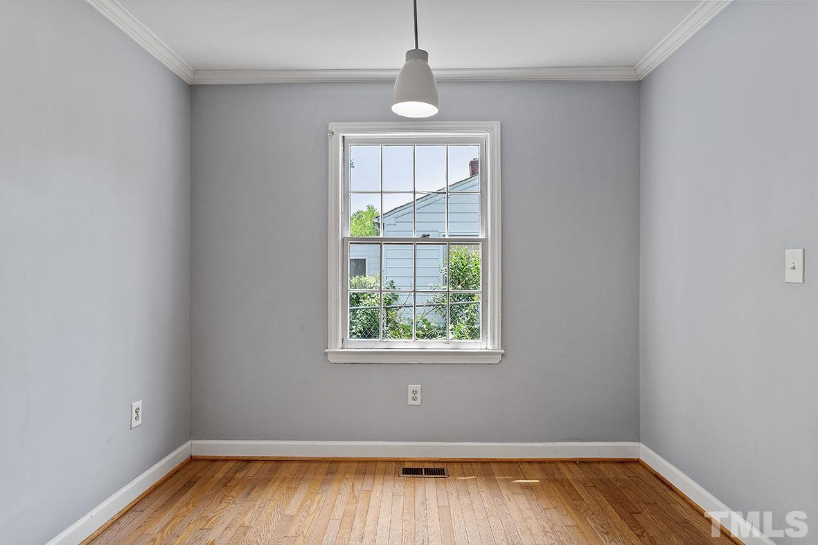 2727 Layden Street Raleigh, NC 27603 - Photo 11 of 23 a view of room with window and wooden floor