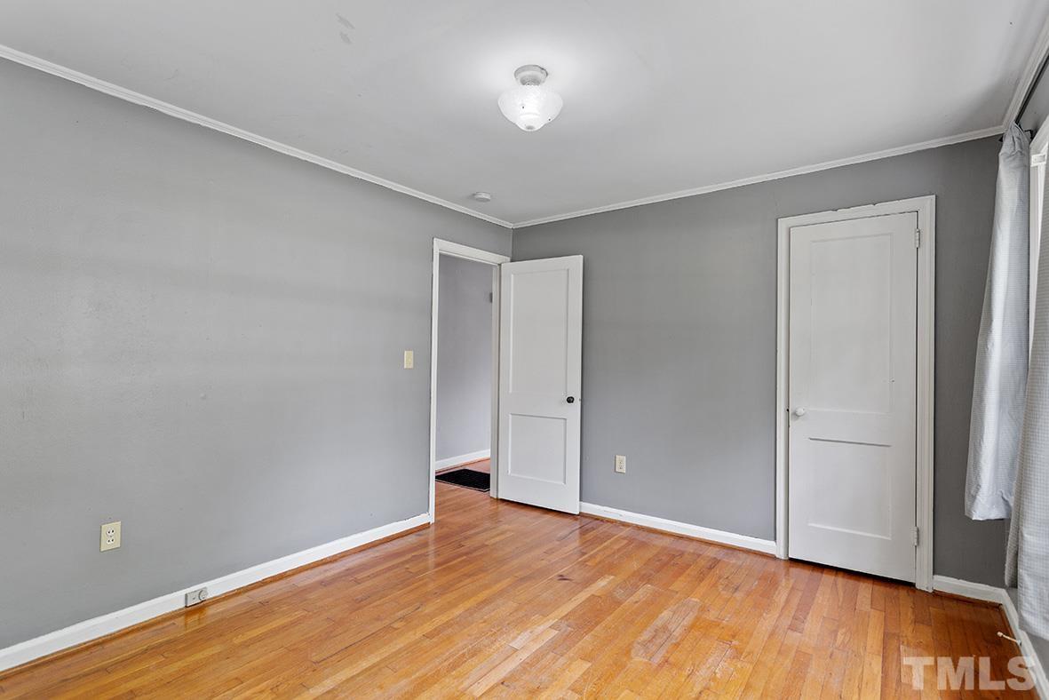 2727 Layden Street Raleigh, NC 27603 - Photo 20 of 23 a view of an empty room with wooden floor and closet