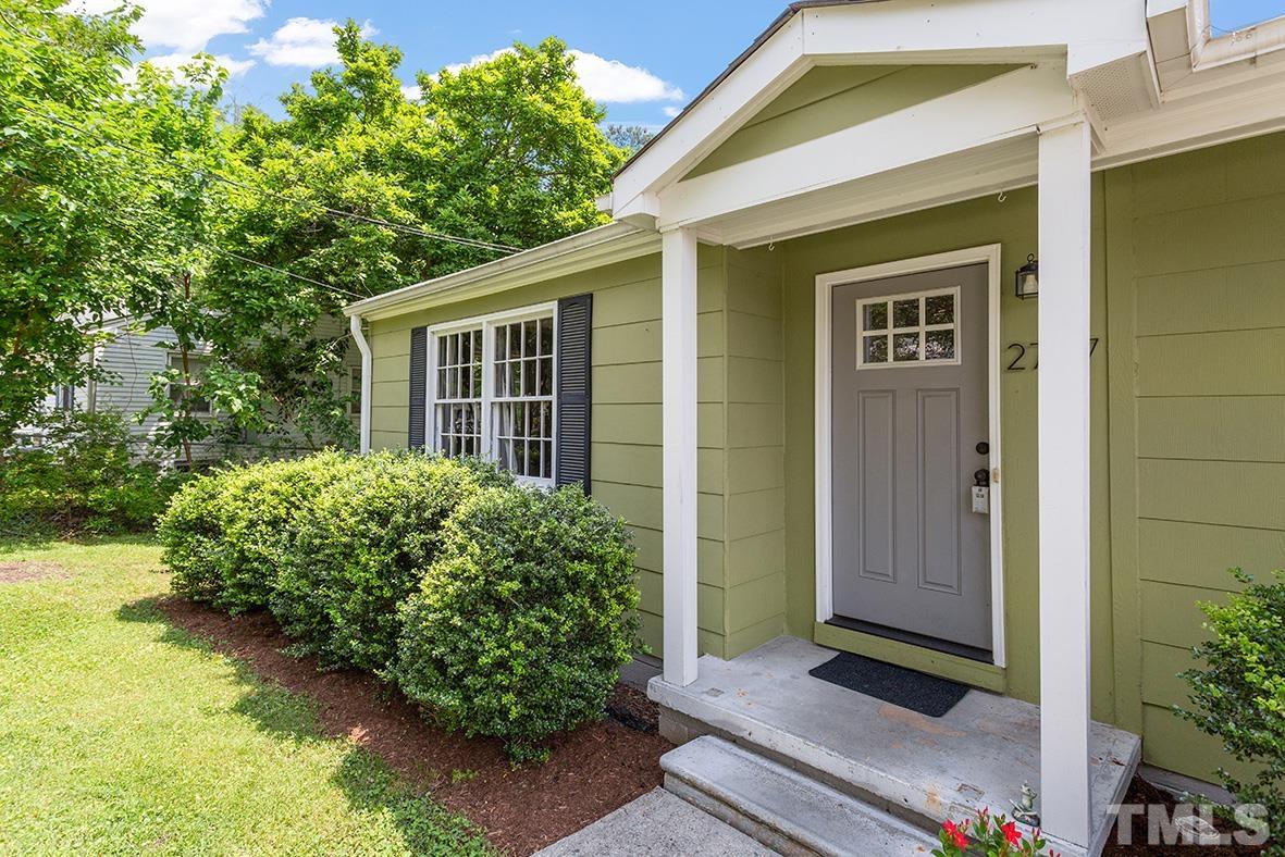 2727 Layden Street Raleigh, NC 27603 - Photo 2 of 23 a front view of a house with garden