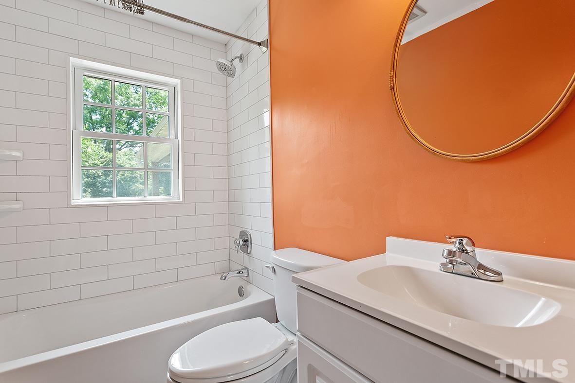 2727 Layden Street Raleigh, NC 27603 - Photo 23 of 23 a bathroom with a sink a toilet and shower