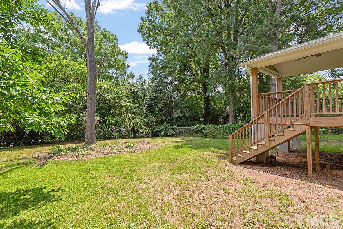 2727 Layden Street Raleigh, NC 27603 - Photo 3 of 23 a view of a house with backyard and trees