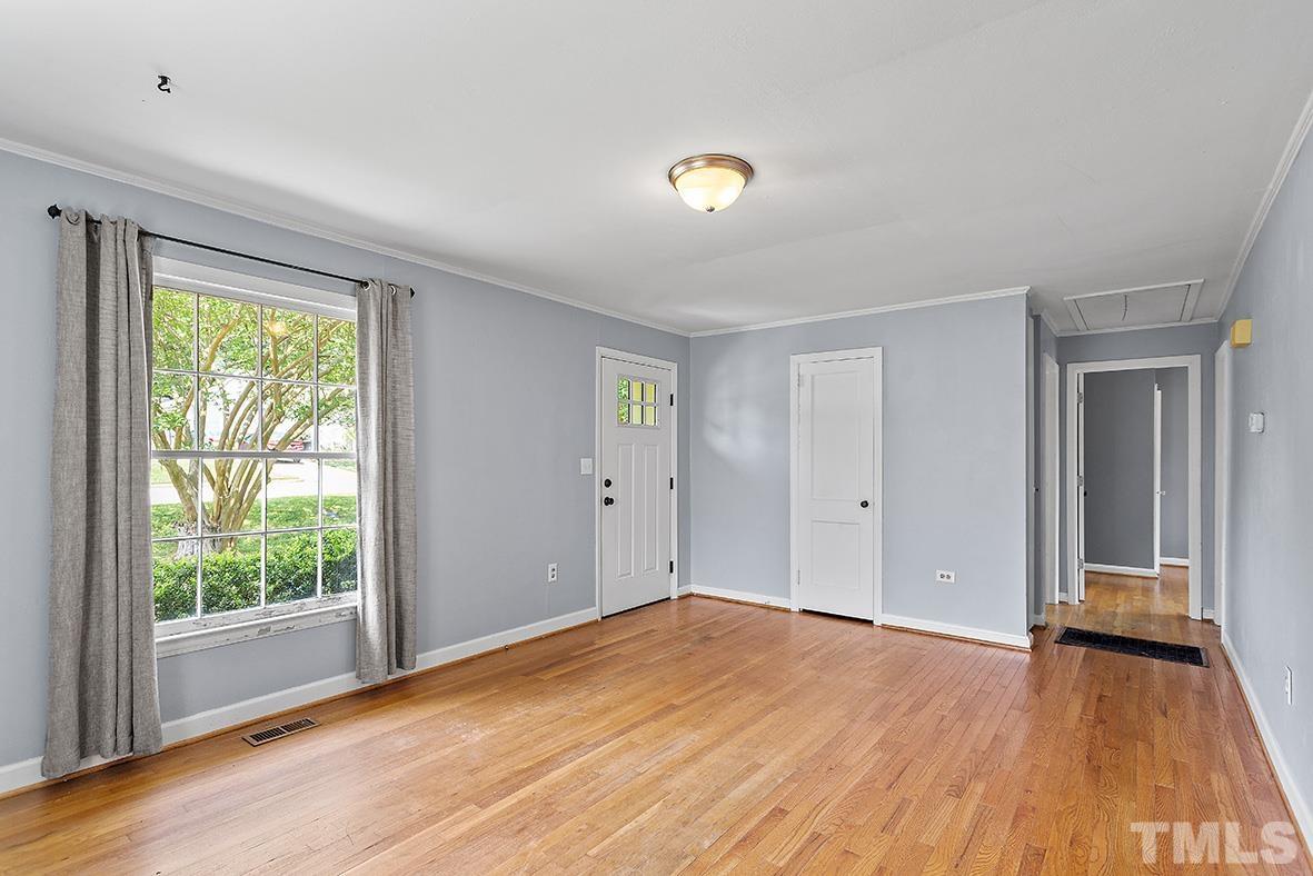2727 Layden Street Raleigh, NC 27603 - Photo 8 of 23 a view of empty room with wooden floor and fan