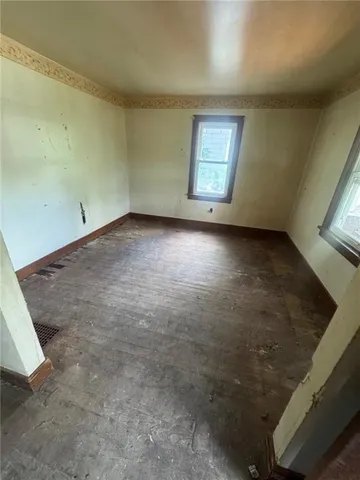 a view of empty room with windows