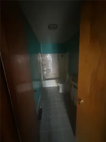 a view of house with roof deck and furniture